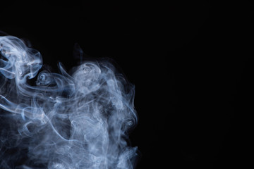white flowing smoke cloud on black background with copy space