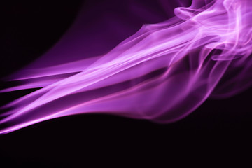 purple colorful flowing smoke on black background