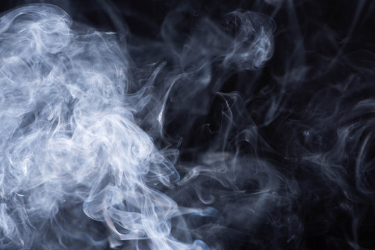 abstract white flowing smoke on black background © LIGHTFIELD STUDIOS