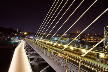 Ataturk metro bridge and golden horn at night - Istanbul, Turkey