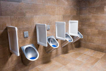 Metal urinals and one for children with an automatic sensor for flushing water after urinating....