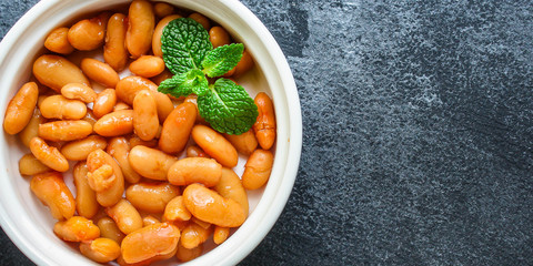 beans in tomato sauce,
keto or paleo diet
menu concept food background. top view. copy spaces for text