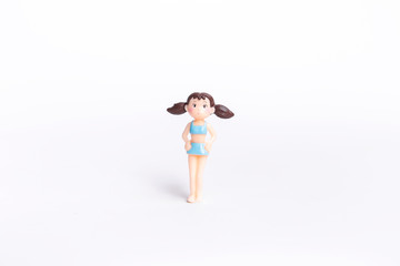Cute little girl doll in blue swimwear isolate on white background, summer fashion