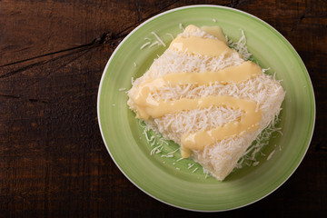 Sweet couscous (tapioca) pudding (cuscuz doce) with coconut