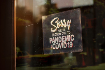 Sorry We are Closed Due to Pandemic Covid-19 Signboard on Shop Window