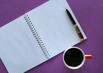 coffee in a cup, pen, and sheets with free space for inscription