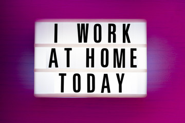 Pink glowing sign with the inscription - I work at home today