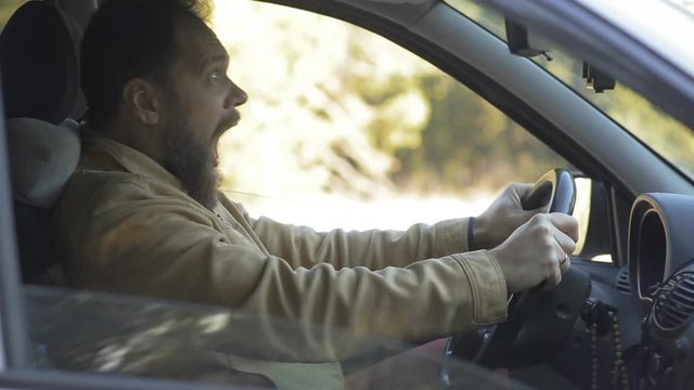 a scared man gets into a traffic accident while talking on the phone, safe and accurate driving
