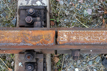 Detail of railway rails, the place where the rails are joined together by bolts and nuts.