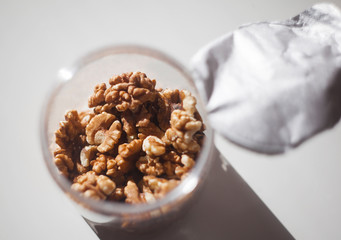 Walnuts in a transparent plastic jar
