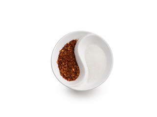Cayenne pepper with sugar in bowl on isolated white background