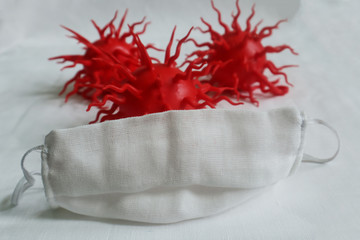 The gauze mask covers the red viruses