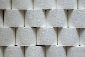 Close view of toilet paper rolls stacked, background