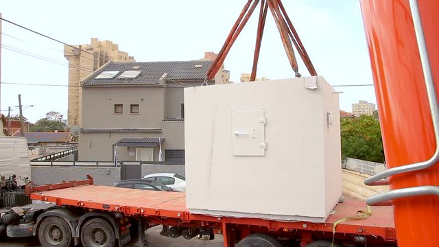 Mobile bomb shelter being deployed in a house in Israel. This is an extra Fortified Room that helps the house residents to be protected from rocket fire attacks. It called Migunit" or "Merkhav Mugan""