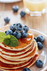 Homemade pancakes, fresh summer berries, coffee and juice