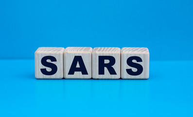concept word SARS on cubes on a blue background