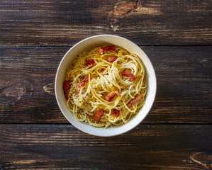 Pasta spaghetti carbonara on a wooden background. Italian cuisine. Recipe. Rustic style.