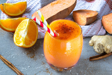 Sweet Potato Smoothie coctail with orange, Cinnamon and ginger. Vitamin, healthy food concept. Copy space