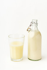 Dairy alternative. Rice milk in a high glass on white background.