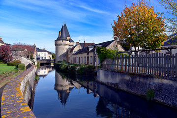 Keep of the fortified gate Saint-Julien on the Huisne river with big reflection at La-Ferté-Bernard, a commune in the Sarthe department in the Pays de la 	Loire region in north-western France.