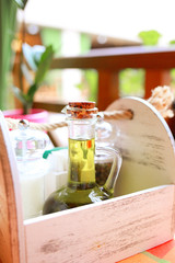 Set in a wooden box of olive oil and spices, salt and pepper peas in a restaurant. Healthy eating concept.