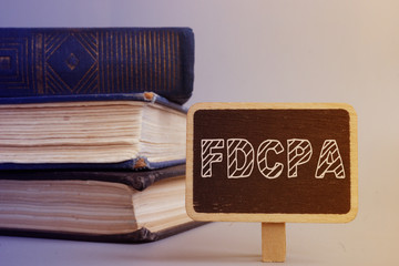 Business photo shows hand written text The Fair Debt Collection Practices Act (FDCPA)