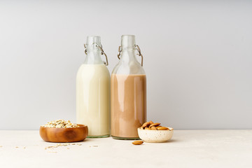 Oat and chocolate almond milk. Dairy alternatives for lactose intolerance. Healthy organic protein source for vegans.