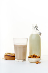 Oat milk and almond milk. Vegan beverage full of proteins. Healthy dairy alternative for lactose intolerance