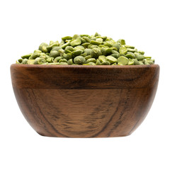 Dry green split peas isolated in bowl on white background