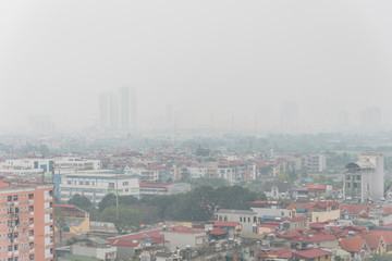 Obraz premium Top view foggy and misty Hanoi urban landscape causes by air pollution