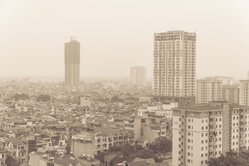 Filtered image top view foggy and misty Hanoi urban landscape causes by air pollution