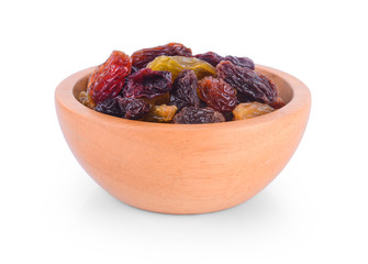 wood bowl Raisins isolated on white background.