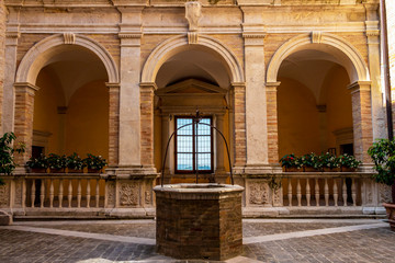 Fermo beautiful old architecture with a well in Fermo, Province of Fermo, Marche Region, Italy