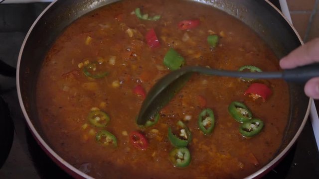 Cooking tomato sauce closeup in 4K
