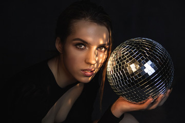 young woman with disco ball