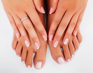 manicure pedicure with flower lily closeup isolated on white background perfect shape hands spa salon