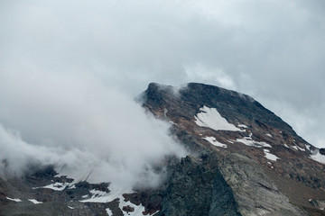 The mountains of Switzerland, the summits of the mountains with snow in summer