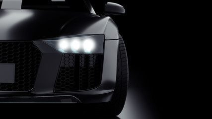 Dark gray modern sport car closeup on black background. Light on
