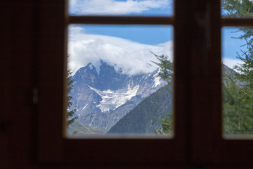 view of the window in switzerland, view of the mountains from the house