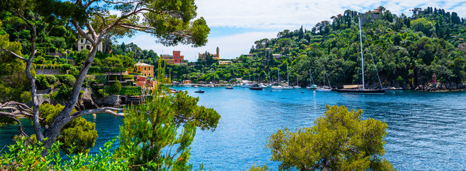 Scenic picture-postcard view of famous with wonderful gulf, luxury villas in mediterranean garden,...
