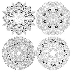 Hand drawn zentangle set of 4 mandalas for coloring page.