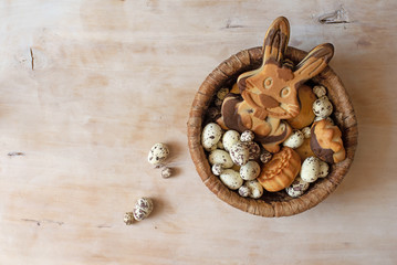 Easter gingerbread cookies on wooden table. Eggs and rabbit like a gingerbread. Top view with space for your greetings