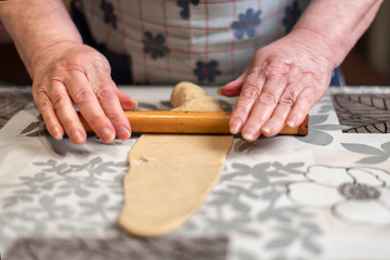 Preparing dough for making homemade pestiños, Christmas sweets or Easter Week, typical of Andalusia.