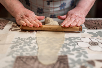 Preparing dough for making homemade pestiños, Christmas sweets or Easter Week, typical of Andalusia.