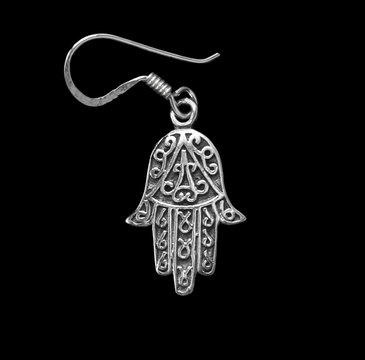 Silver earring. Jewelry. 
Fatima's hand. Miriam's hand. 
Amulet of Hamsa.