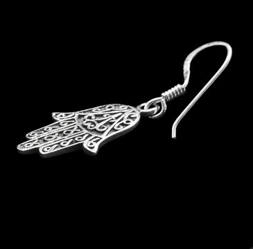 Silver earring. Jewelry. 
Fatima's hand. Miriam's hand. 
Amulet of Hamsa.