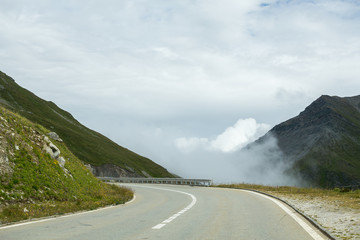 mountain serpentine, road in the clouds, switzerland in the summer