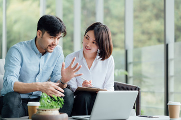 Young Asian business man and woman