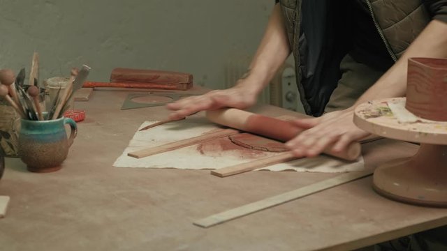 Ceramist work in the workshop.