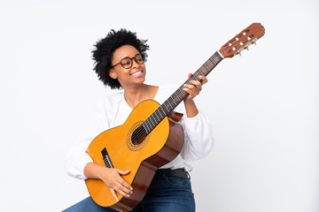 African american woman with guitar over isolated background